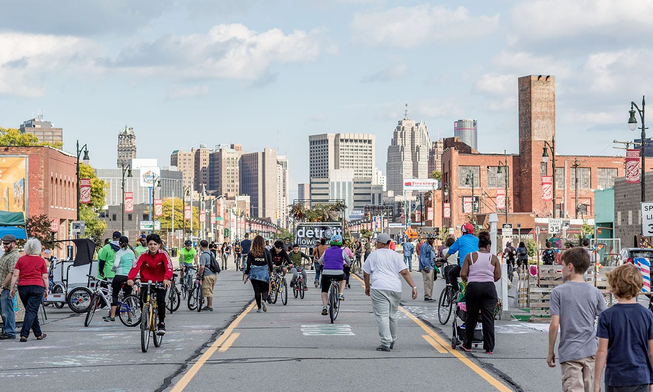 Image of people walking in the streets of Detroit.